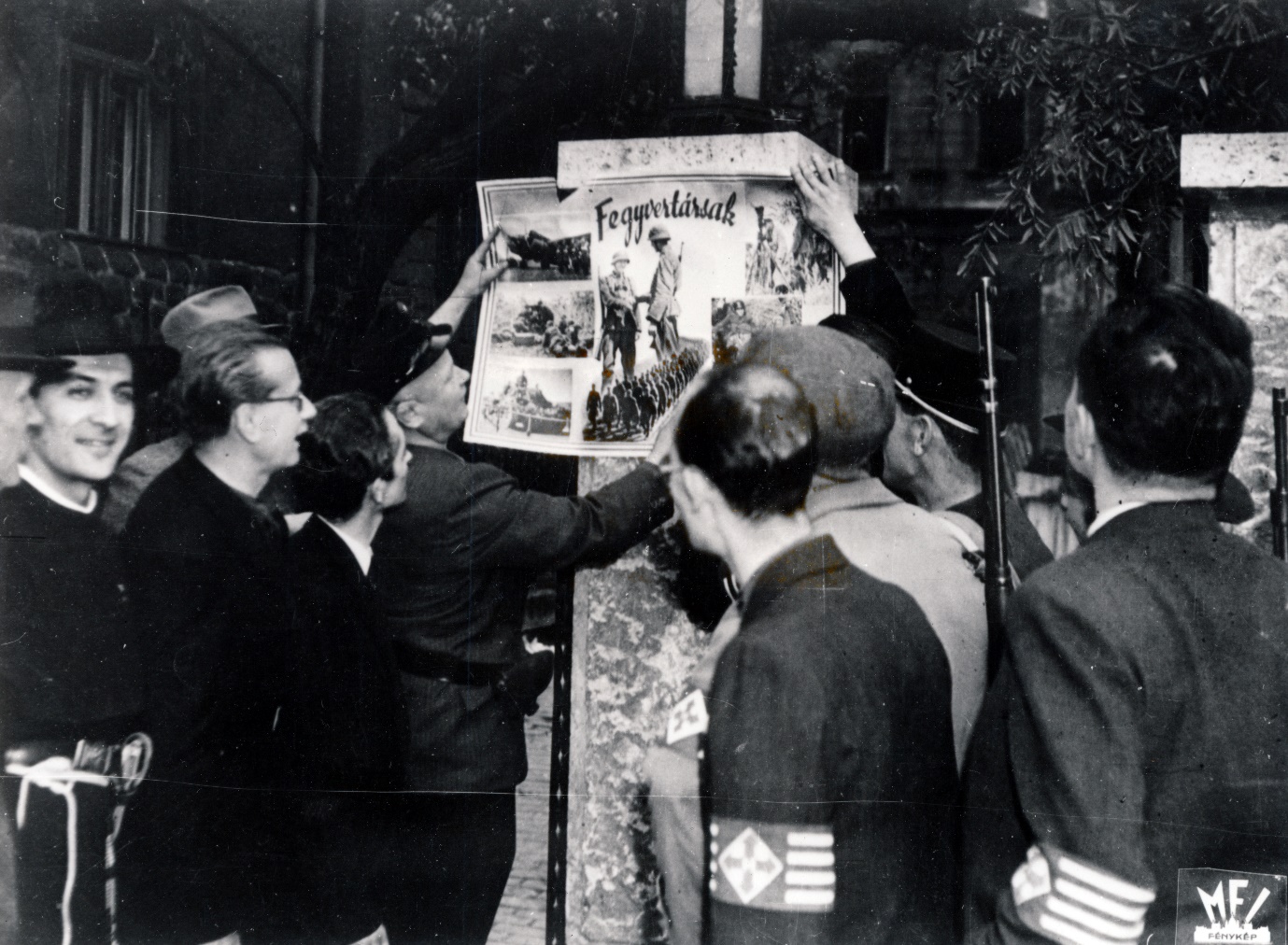 Arrow Cross Party servicemen, with Andr&aacute;s Kun in clerical garb on the left of the picture (Fortepan)