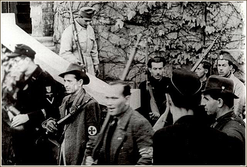 Militiamen on the day of the takeover at the Arrow Cross weapons depot at 10 Pasar&eacute;ti Street, Budapest